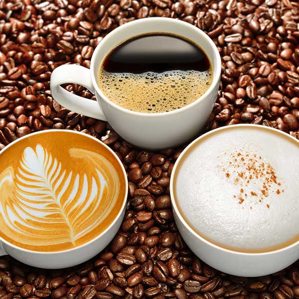 Coffee mugs in coffee beans